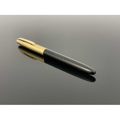 69 - Conway Stewart, a Conway 106 mark IV fountain pen, circ 1960s, gilt metal cap and black barrel with ... 