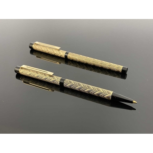 70 - Sheaffer, a Targa Slim fountain pen and ballpoint, circa 1980s, gilt weave over black, 14 carat gold... 