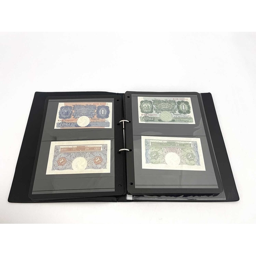 76 - English Banknotes, a black vinyl album containing a collection of 98 mint unused English Bank Notes ... 