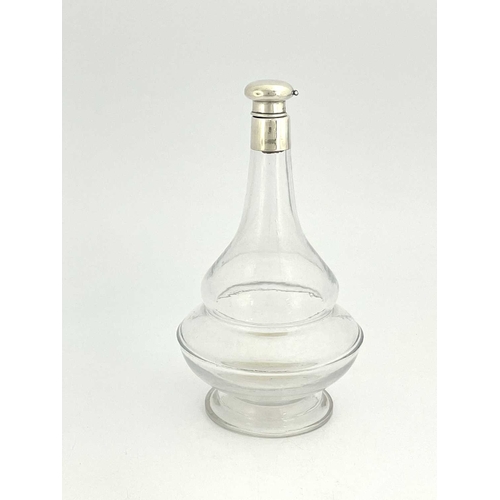 84 - A George V silver mounted glass decanter, double ogee gourd form with deep foot, silver pommel and c... 