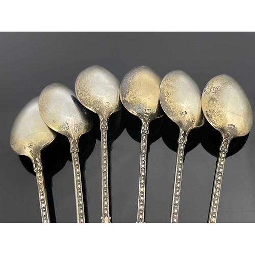 86 - A set of six Continental silver gilt and enamelled figural Blackamoor teaspoons, Austrian import mar... 