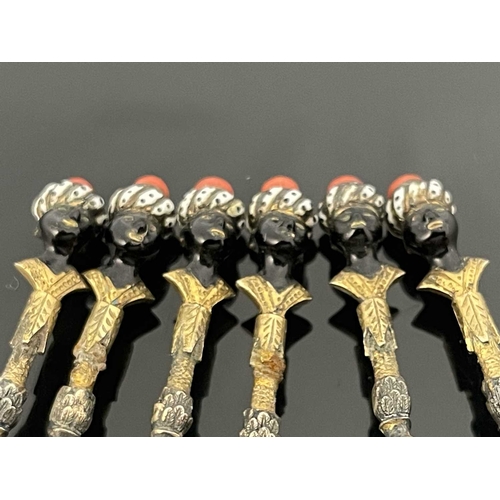 86 - A set of six Continental silver gilt and enamelled figural Blackamoor teaspoons, Austrian import mar... 