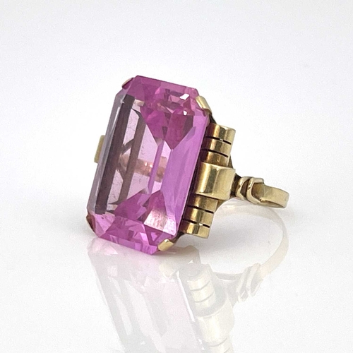 9 - A yellow gold ring, set emerald-cut pink stone, (possibly synthetic)