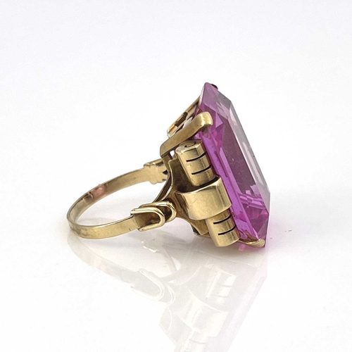 9 - A yellow gold ring, set emerald-cut pink stone, (possibly synthetic)