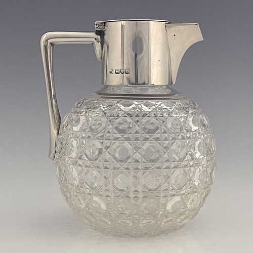 90 - After Christopher Dresser, an Aesthetic Movement silver and cut glass claret jug, Heath and Middleto... 