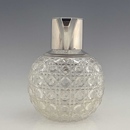 90 - After Christopher Dresser, an Aesthetic Movement silver and cut glass claret jug, Heath and Middleto... 