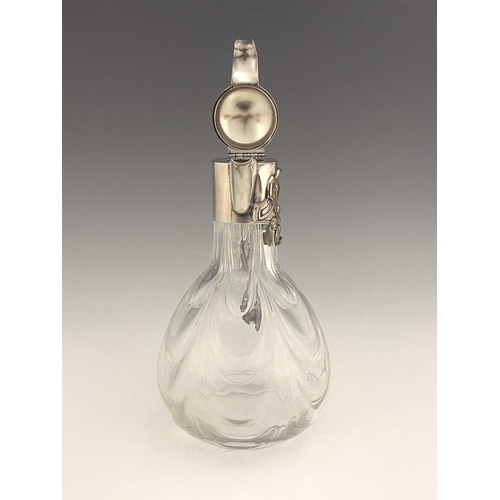 92 - A Jugendstil silver plate and glass claret jug, circa 1900, the optic swag moulded body of bulbous f... 