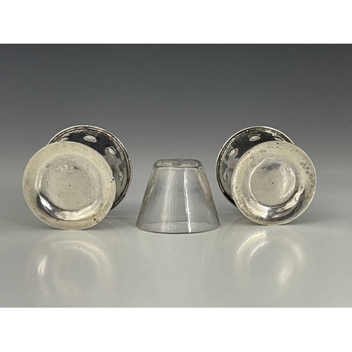 94 - Bernard Cuzner, a pair of Arts and Crafts silver salt cellars, Birmingham 1905, conical footed bucke... 