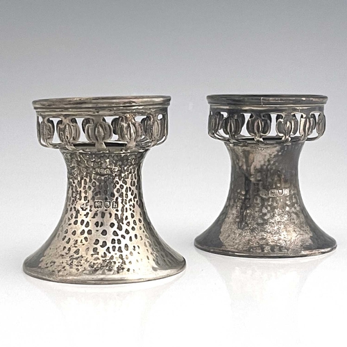 96 - A pair of Arts and Crafts silver pedestal salt cellars, William Hutton and Sons, London 1903, planis... 