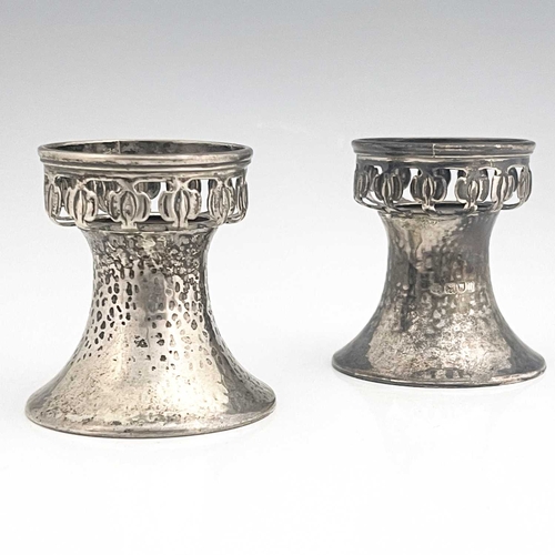 96 - A pair of Arts and Crafts silver pedestal salt cellars, William Hutton and Sons, London 1903, planis... 