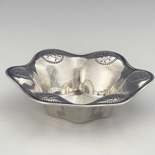 102 - Bernard Cuzner for Liberty and Co, an Arts and Crafts silver dish, Birmingham 1912, hexagonal lobed ... 