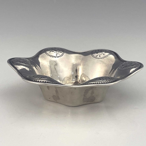 102 - Bernard Cuzner for Liberty and Co, an Arts and Crafts silver dish, Birmingham 1912, hexagonal lobed ... 