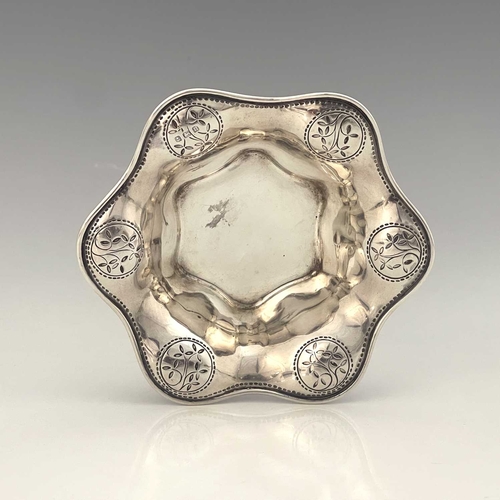 102 - Bernard Cuzner for Liberty and Co, an Arts and Crafts silver dish, Birmingham 1912, hexagonal lobed ... 