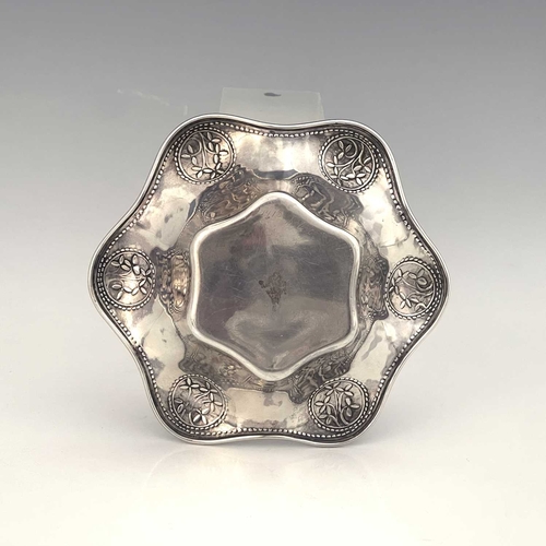 102 - Bernard Cuzner for Liberty and Co, an Arts and Crafts silver dish, Birmingham 1912, hexagonal lobed ... 