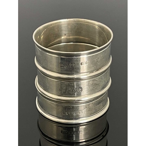 104 - Charles Horner, three Arts and Crafts silver and enamelled napkin rings, Chester 1917 and 1923, circ... 