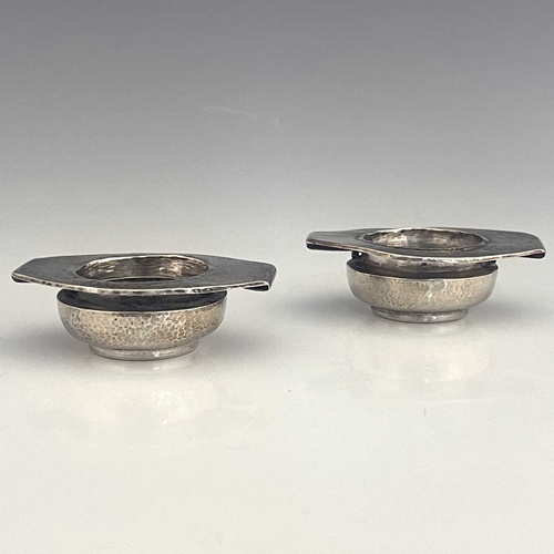 105 - Oliver Baker for Liberty and Co., a pair of Arts and Crafts silver salt cellars, Birmingham 1900, pl... 