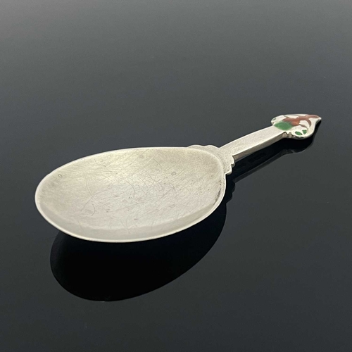 106 - Archibald Knox for Liberty and Co., an Arts and Crafts silver and enamelled caddy spoon, Birmingham ... 