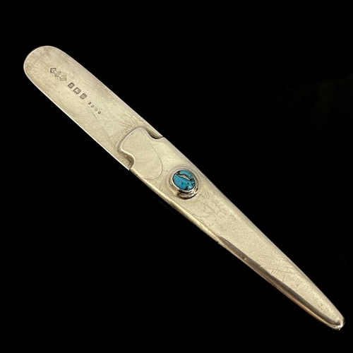 108 - Oliver Baker for Liberty and Co., a Cymric Arts and Crafts silver and cabochon butter knife, Birming... 