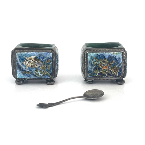 110 - A pair of Arts and Crafts enamelled and silver plated salt cellars, circa 1910, cuboid form each wit... 