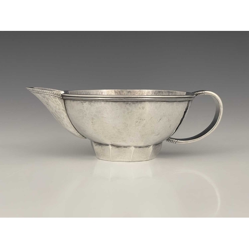 111 - Edward Spencer for Artificers Guild, an Arts and Crafts silver sauce boat, London 1932, planished ov... 