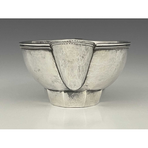 111 - Edward Spencer for Artificers Guild, an Arts and Crafts silver sauce boat, London 1932, planished ov... 