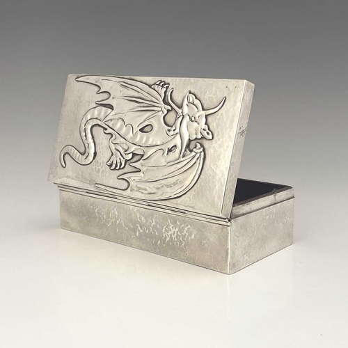 114 - Sibyl Dunlop, an Arts and Crafts silver cigar box, London 1923, planished cuboid form, the hinged li... 