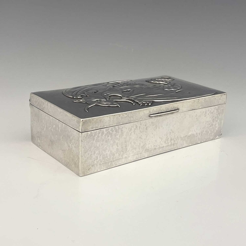 114 - Sibyl Dunlop, an Arts and Crafts silver cigar box, London 1923, planished cuboid form, the hinged li... 