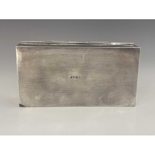 114 - Sibyl Dunlop, an Arts and Crafts silver cigar box, London 1923, planished cuboid form, the hinged li... 