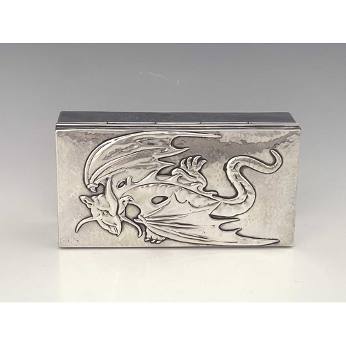 114 - Sibyl Dunlop, an Arts and Crafts silver cigar box, London 1923, planished cuboid form, the hinged li... 