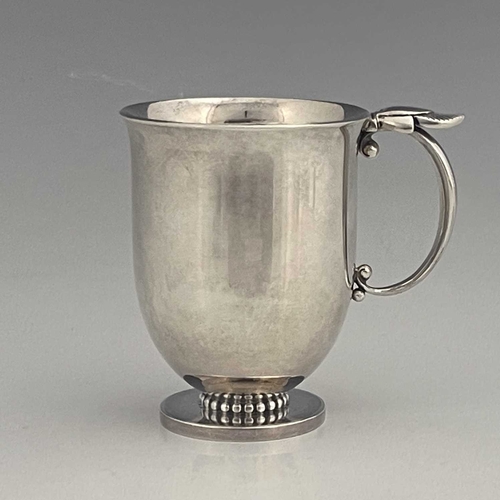 118 - Gundorph Albertus for Georg Jensen, a Cactus pattern silver mug, model 777, import marks London 1961... 