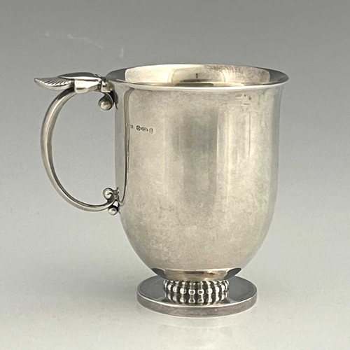 118 - Gundorph Albertus for Georg Jensen, a Cactus pattern silver mug, model 777, import marks London 1961... 