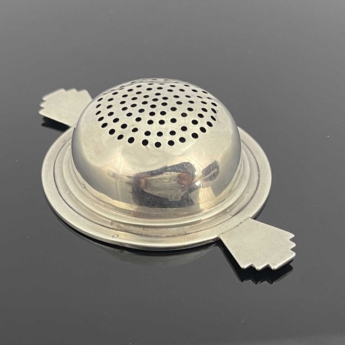 123 - An Art Deco silver tea strainer, Barker Brothers Silver, Birmingham 1935, stepped rim hemispherical ... 