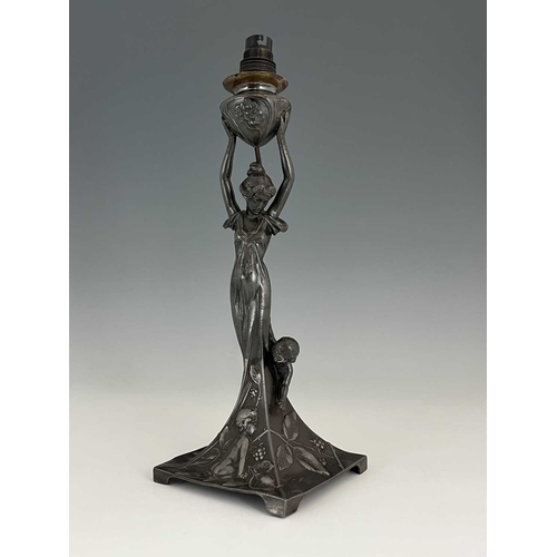 139 - WMF, a Jugendstil silver plated figural table lamp, the square sweeping base modelled in relief with... 