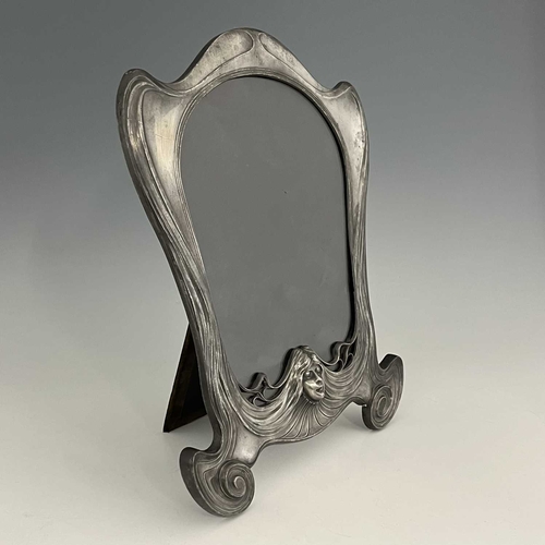 141 - Orivit, a Jugendstil pewter frame, model 2280, circa 1905, ogee bracketed shield form, modelled in r... 