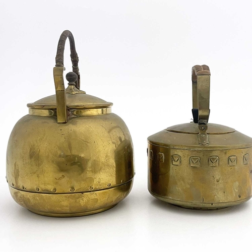 144 - Two Secessionist brass kettles, in the style of WMF, each with rattan top handles (2)