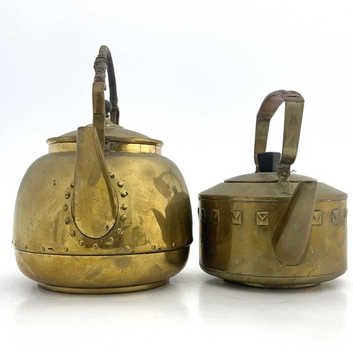 144 - Two Secessionist brass kettles, in the style of WMF, each with rattan top handles (2)