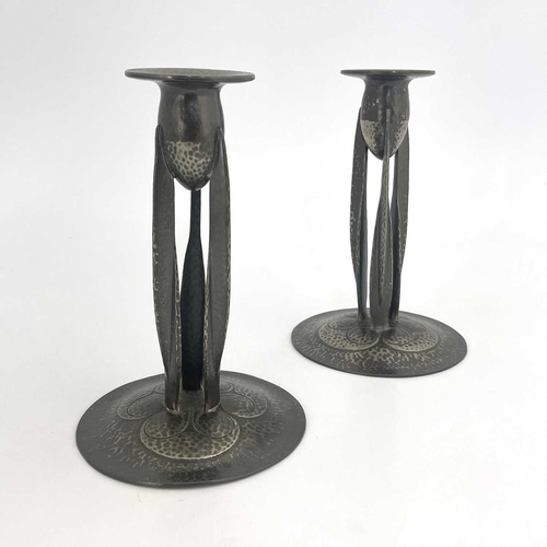 148 - Archibald Knox for Liberty and Co., a pair of Tudric Arts and Crafts pewter candlesticks, model 0223... 