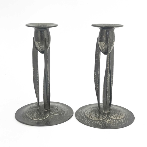 148 - Archibald Knox for Liberty and Co., a pair of Tudric Arts and Crafts pewter candlesticks, model 0223... 