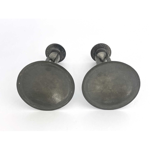 148 - Archibald Knox for Liberty and Co., a pair of Tudric Arts and Crafts pewter candlesticks, model 0223... 