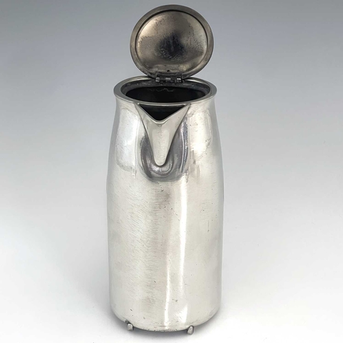 153 - Archibald Knox for Liberty and Co., a Tudric Arts and Crafts pewter hot water jug, model 0231, taper... 