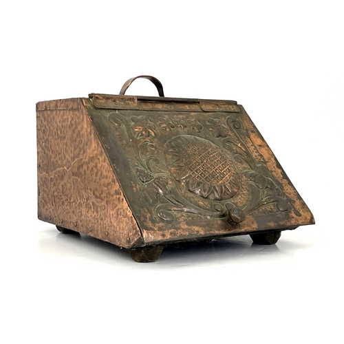 158 - John Pearson (attributed) an Arts and Crafts copper clad coal scuttle, the hinged lid repousse embos... 