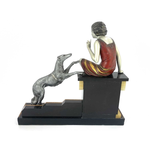 178 - An Art Deco patinated art metal figure group, circa 1930, modelled as a woman sitting on a plinth wi... 