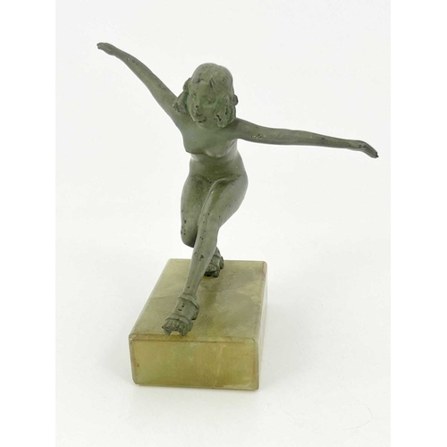 180 - An Art Deco bronze figure, circa 1925, modelled as a nude woman roller skating, verdigris patination... 