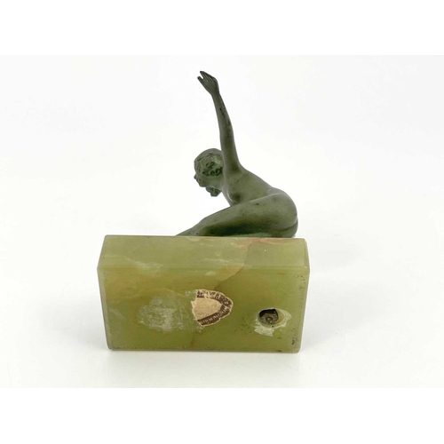 180 - An Art Deco bronze figure, circa 1925, modelled as a nude woman roller skating, verdigris patination... 