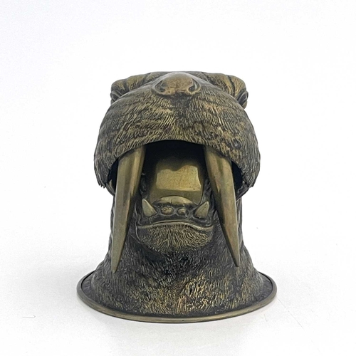 188 - A novelty brass inkwell, circa 1880, realistically modelled as a walrus head, mouth open, 10.5cm hig... 