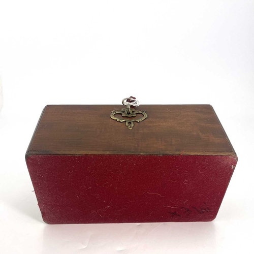 189 - A George II mahogany tea caddy, circa 1740, 'C' scroll brass swing handle, moulded caddy top, fretwo... 