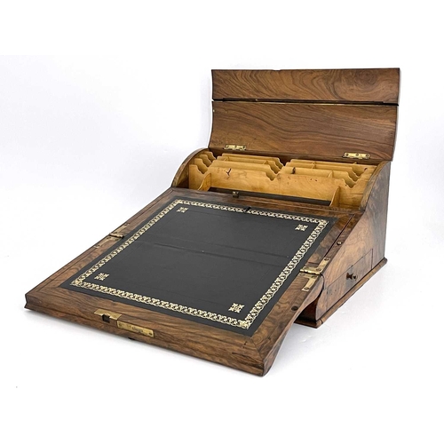 193 - A mid-Victorian burr walnut writing slope, circa 1860, of serpentine form, pierced brass Gothic moun... 