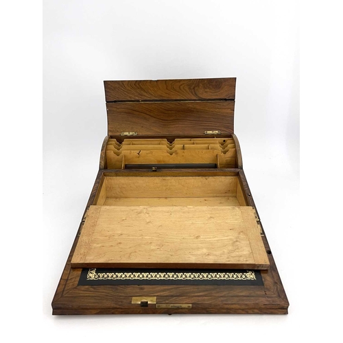 193 - A mid-Victorian burr walnut writing slope, circa 1860, of serpentine form, pierced brass Gothic moun... 