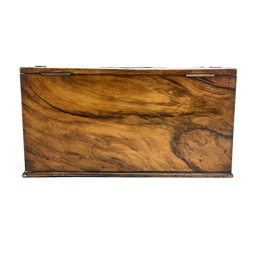 193 - A mid-Victorian burr walnut writing slope, circa 1860, of serpentine form, pierced brass Gothic moun... 