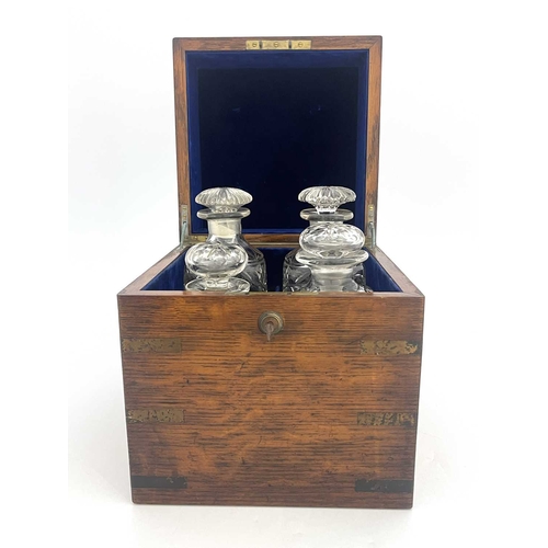 198 - A 19th Century oak and brass bound decanter box, flush side handles, blue velvet fitted interior con... 